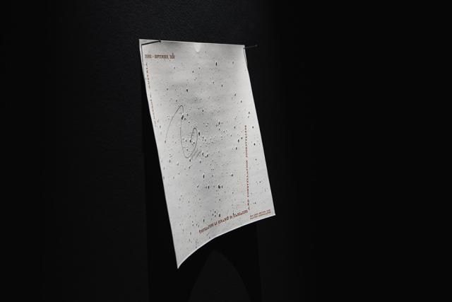 The image shares a star map hung on the wall with two nails. 