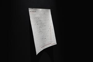 The image shares a star map hung on the wall with two nails. 